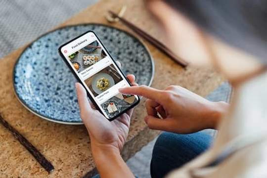 woman ordering food on phone